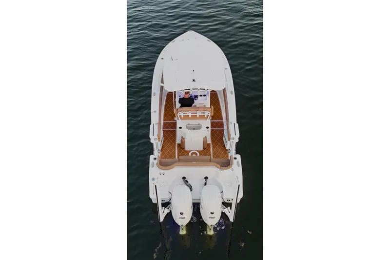 Slide: The Image of 2024 Sea Hunt Ultra 265 SE boat, aerial view, on calm water. - 42