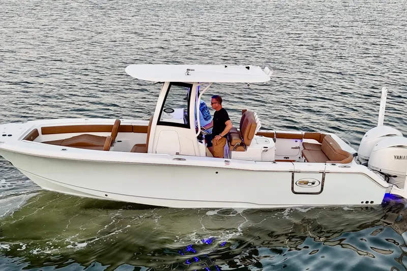 Slide: The Image of 2024 Sea Hunt Ultra 265 SE boat cruising on water with passengers. - 43
