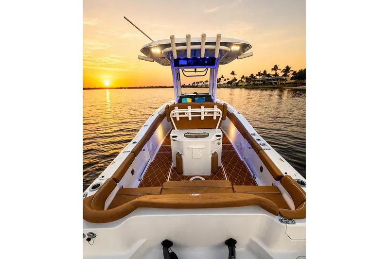 Slide: The Image of 2024 Sea Hunt Ultra 265 SE boat at sunset on calm waters. - 50