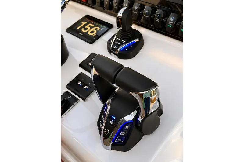 Slide: The Image of Control panel of 2024 Sea Hunt Ultra 265 SE boat with advanced throttle system. - 7