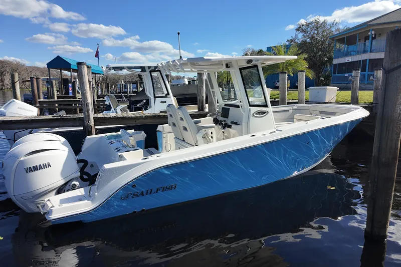 The Image of 2026 Sailfish 252 CC boat docked with Yamaha engine. - 0