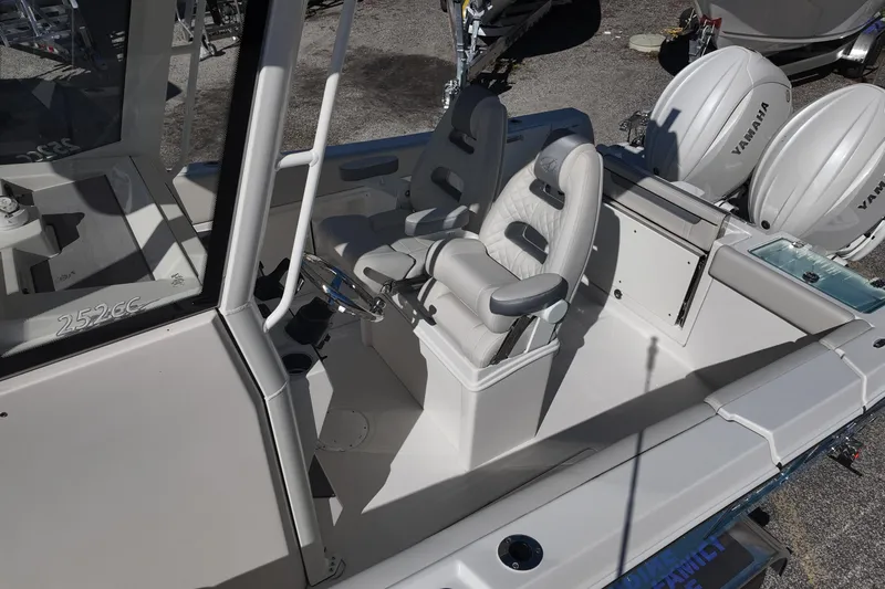 Slide: The Image of 2026 Sailfish 252 CC boat interior with dual Yamaha engines and comfortable seating. - 11