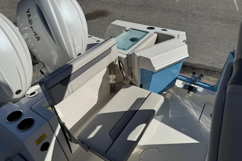 Slide: The Image of 2026 Sailfish 252 CC boat interior with seating and dual Yamaha engines. - 13