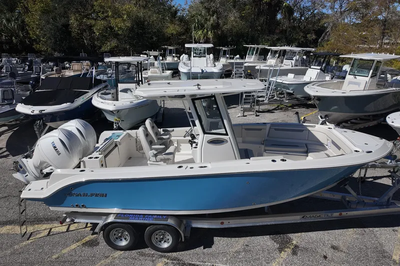 Slide: The Image of 2026 Sailfish 252 CC boat with Yamaha engines on trailer in marina. - 3