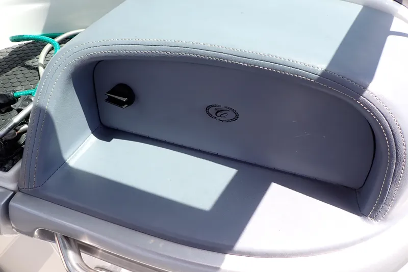 Slide: The Image of Cobalt 240 boat interior detail, 2002 model, featuring a storage compartment with a sleek design. - 44