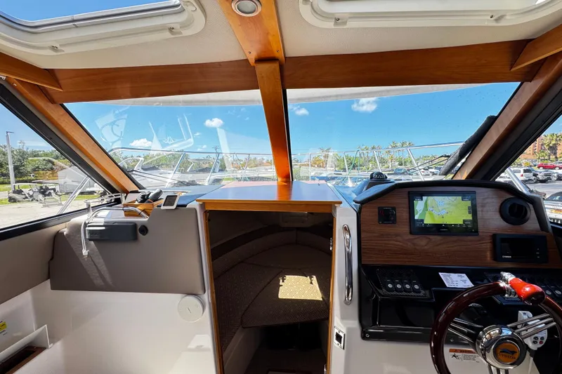 Slide: The Image of Interior view of 2022 Cutwater C-248 Coupe boat cockpit with navigation system. - 14
