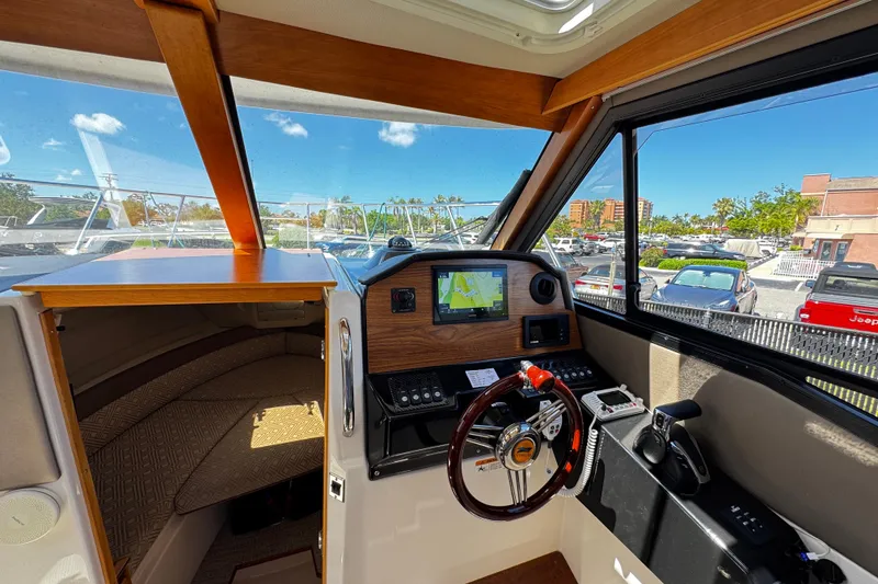 Slide: The Image of Interior view of 2022 Cutwater C-248 Coupe boat cockpit with navigation system. - 15