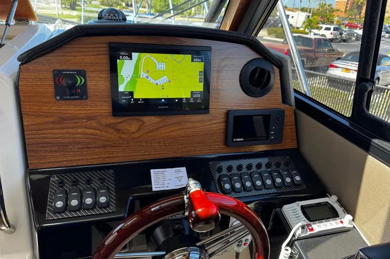 Slide: The Image of 2022 Cutwater C-248 Coupe helm with Garmin navigation and Yamaha controls. - 17