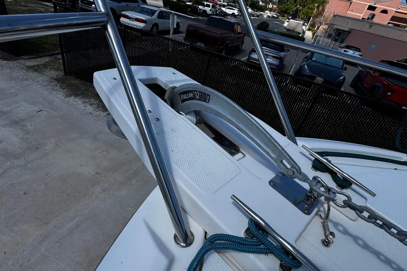 Slide: The Image of 2022 Cutwater C-248 Coupe boat anchor system with Vulcan 12 anchor, docked in a marina. - 25