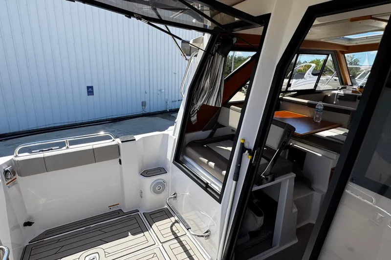Slide: The Image of Interior view of 2022 Cutwater C-248 Coupe boat, featuring seating and table. - 8