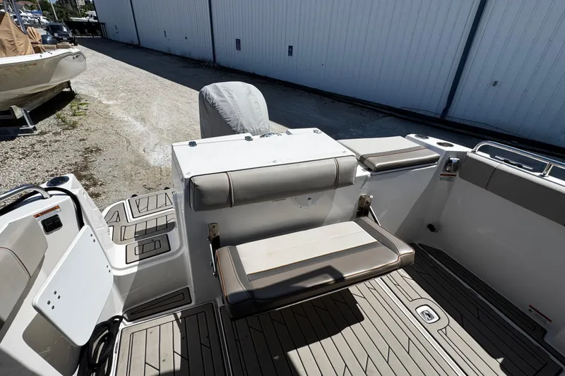 Slide: The Image of 2022 Cutwater C-248 Coupe boat interior with cushioned seating and deck view. - 9