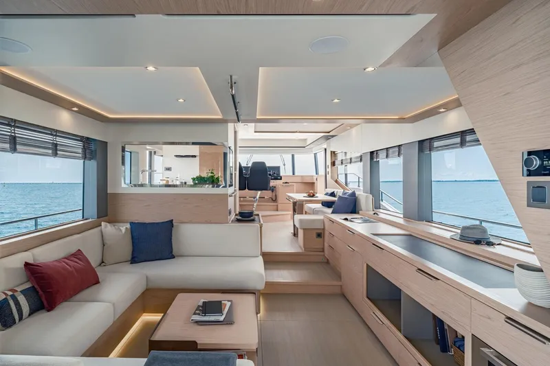 Slide: The Image of Luxurious interior of 2022 Beneteau Grand Trawler 62 yacht with modern furnishings and ocean view. - 4