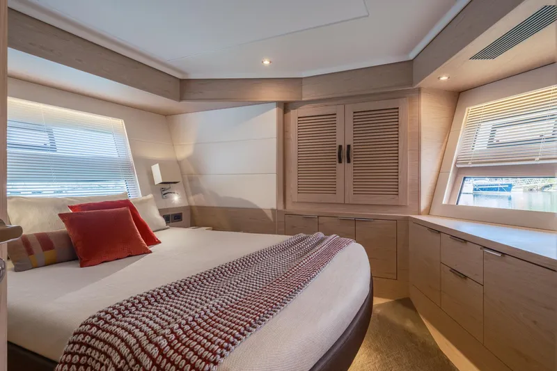Slide: The Image of Luxurious bedroom interior of 2022 Beneteau Grand Trawler 62 yacht with modern design. - 9