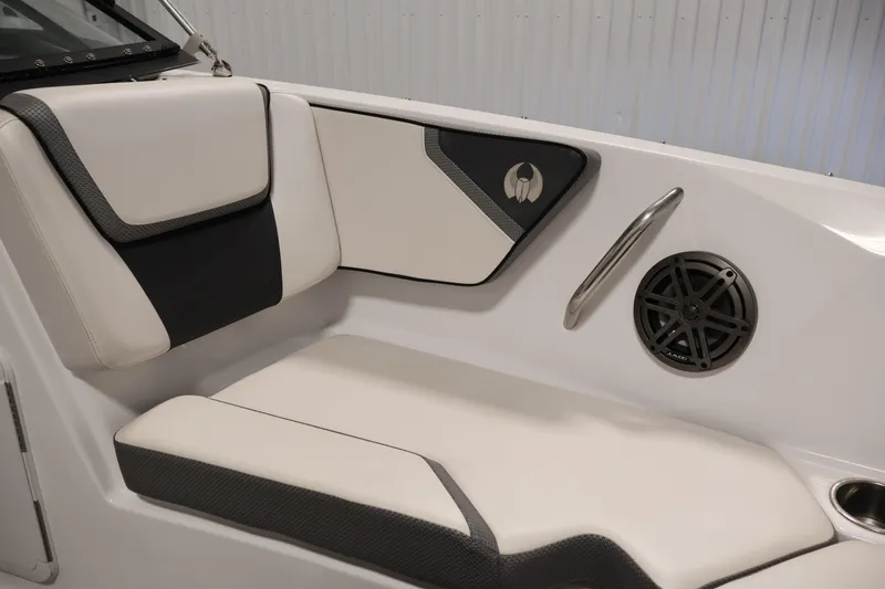 Slide: The Image of 2021 Scarab 215 ID boat interior with cushioned seating and speaker detail. - 13