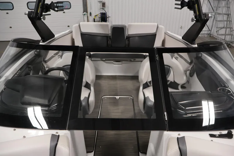 Slide: The Image of Interior view of 2021 Scarab 215 ID boat, featuring sleek seating and modern design. - 15
