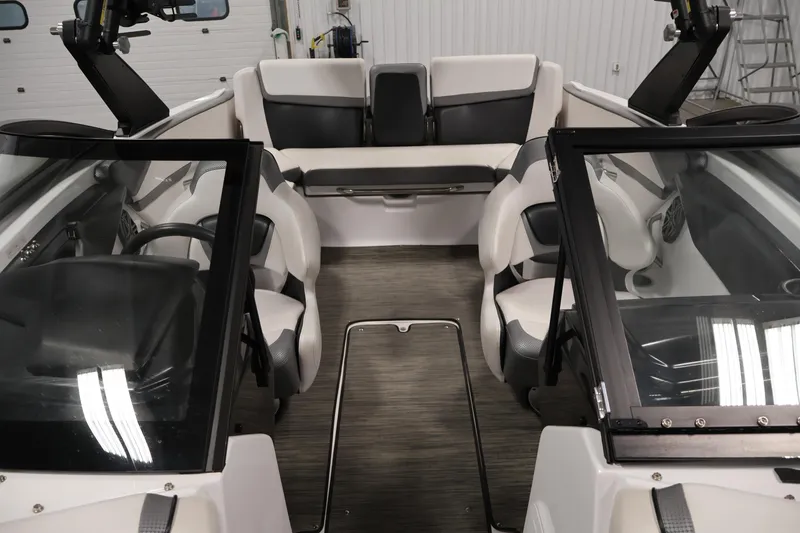 Slide: The Image of Interior of a 2021 Scarab 215 ID boat, featuring sleek seating and modern design. - 16