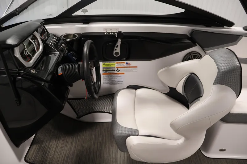 Slide: The Image of Interior of a 2021 Scarab 215 ID boat, featuring a sleek cockpit and modern controls. - 17