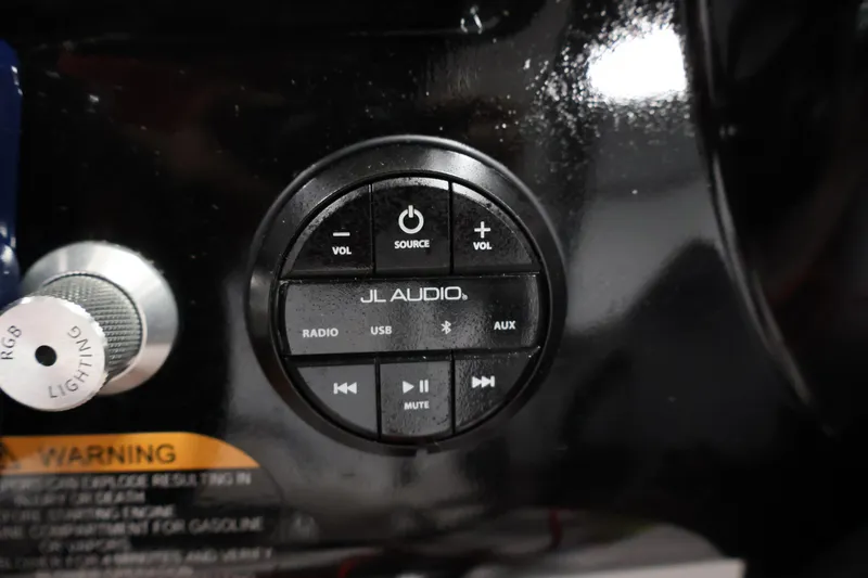 Slide: The Image of JL Audio control panel on 2021 Scarab 215 ID boat dashboard. - 23