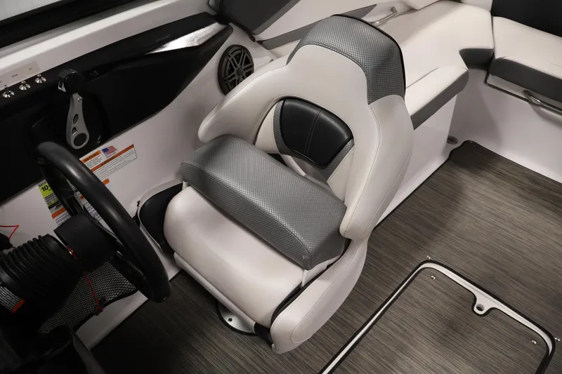 Slide: The Image of 2021 Scarab 215 ID boat interior with modern seating and steering wheel. - 26