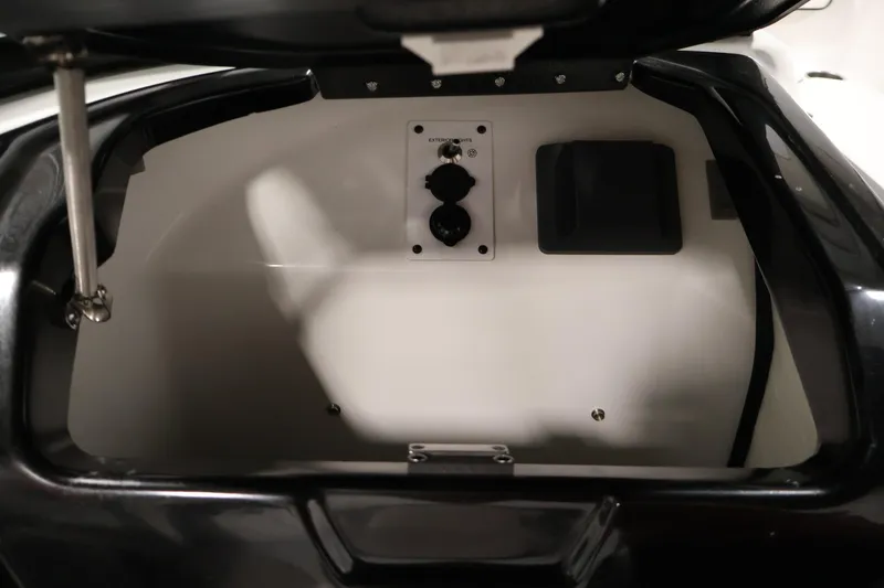 Slide: The Image of Storage compartment of a 2021 Scarab 215 ID boat, featuring interior details. - 28