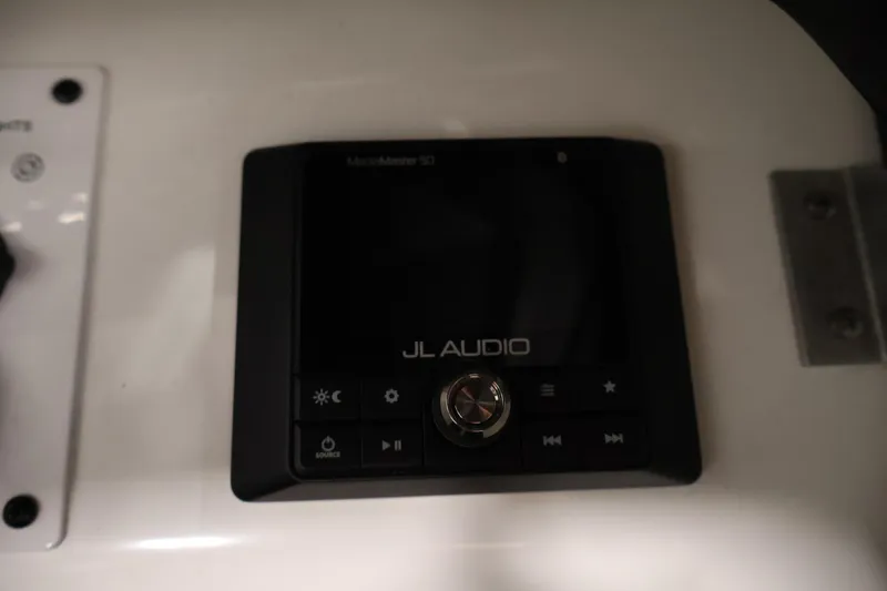 Slide: The Image of JL Audio control panel in a 2021 Scarab 215 ID boat. - 29