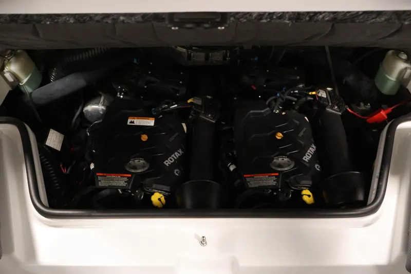 Slide: The Image of Engine compartment of a 2021 Scarab 215 ID boat featuring dual Rotax engines. - 36