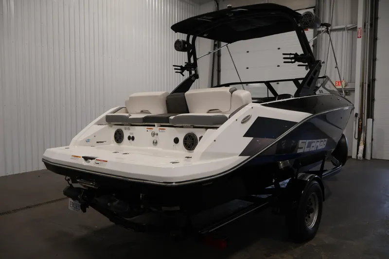 Slide: The Image of 2021 Scarab 215 ID boat in a garage, showcasing sleek design and modern features. - 4