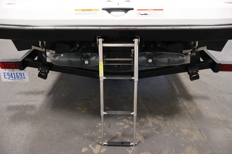 Slide: The Image of Rear view of 2021 Scarab 215 ID boat with ladder and trailer. - 43