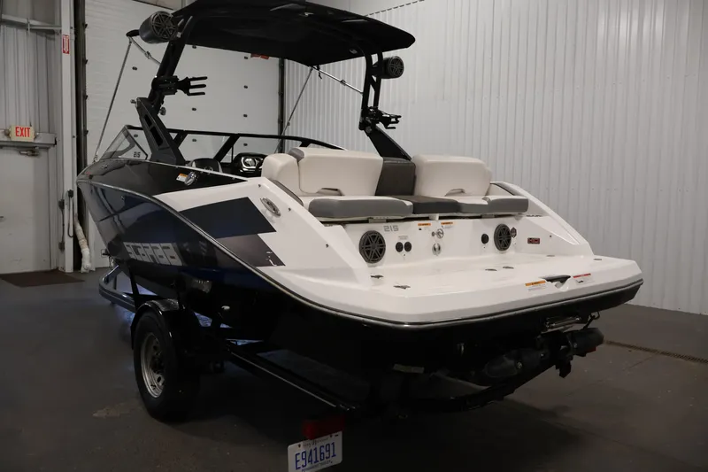 Slide: The Image of 2021 Scarab 215 ID boat in a garage, showcasing sleek design and modern features. - 6