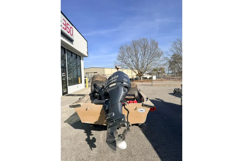 Slide: The Image of Rear view of a 2006 HIGH TIDE 15 boat with Yamaha outboard motor. - 3