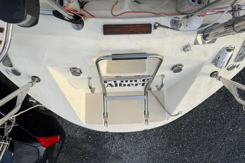 Slide: The Image of Rear view of 2001 Caliber 47LRC yacht with ladder and deck details. - 11