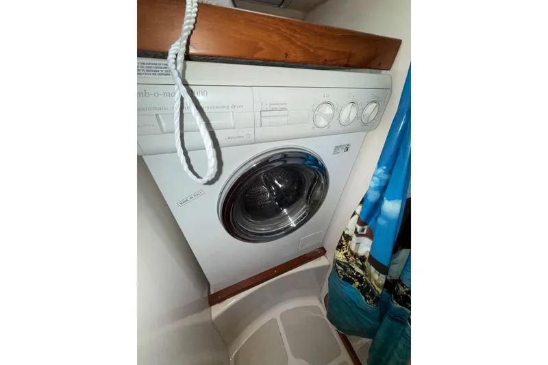 Slide: The Image of Compact washing machine in a 2001 Caliber 47LRC boat interior. - 22
