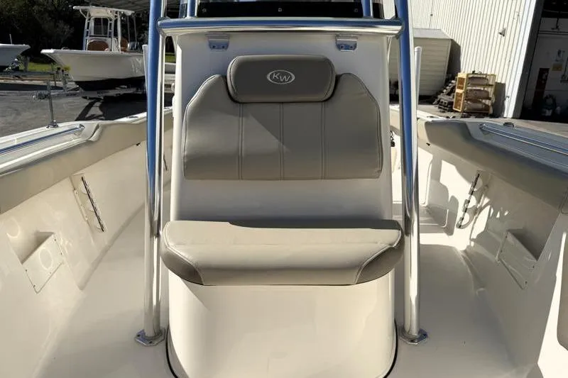 Slide: The Image of 2024 Key West 239 FS boat interior with cushioned seating and sleek design. - 15