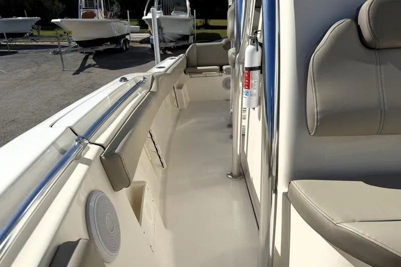 Slide: The Image of 2024 Key West 239 FS boat interior with seating and safety equipment. - 17