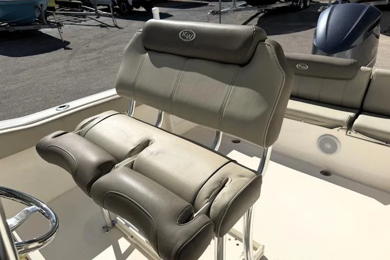 Slide: The Image of 2024 Key West 239 FS boat seating with cushioned backrest and armrests. - 19