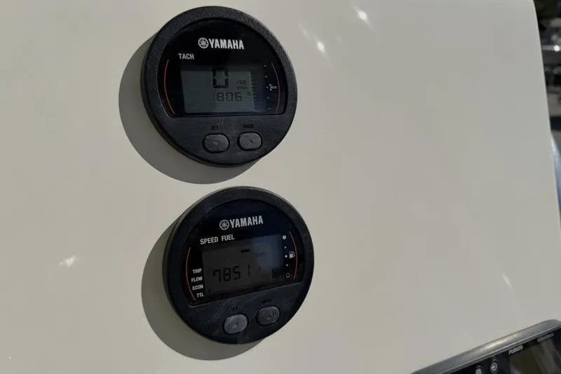 Slide: The Image of Yamaha tachometer and speed fuel gauges on 2024 Key West 239 FS boat dashboard. - 23