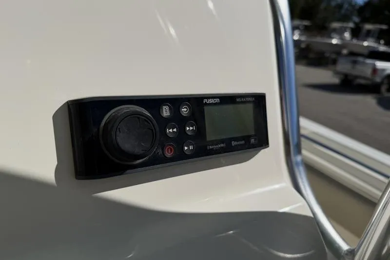 Slide: The Image of 2024 Key West 239 FS boat stereo system, Fusion MS-RA70N, mounted on dashboard. - 24
