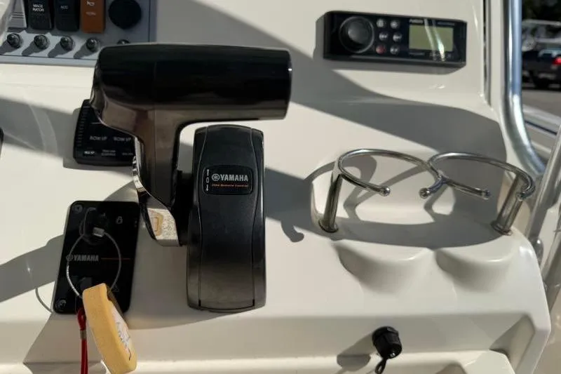 Slide: The Image of 2024 Key West 239 FS boat console with Yamaha controls and cup holders. - 25