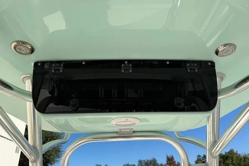 Slide: The Image of 2024 Key West 239 FS boat T-top with integrated lighting and storage compartment. - 26