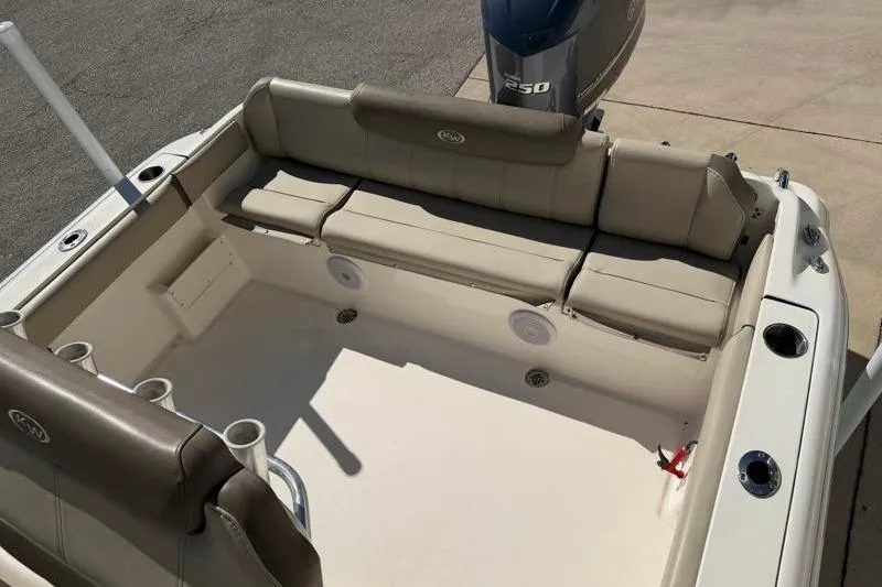 Slide: The Image of 2024 Key West 239 FS boat interior with seating and Yamaha 250 engine. - 28