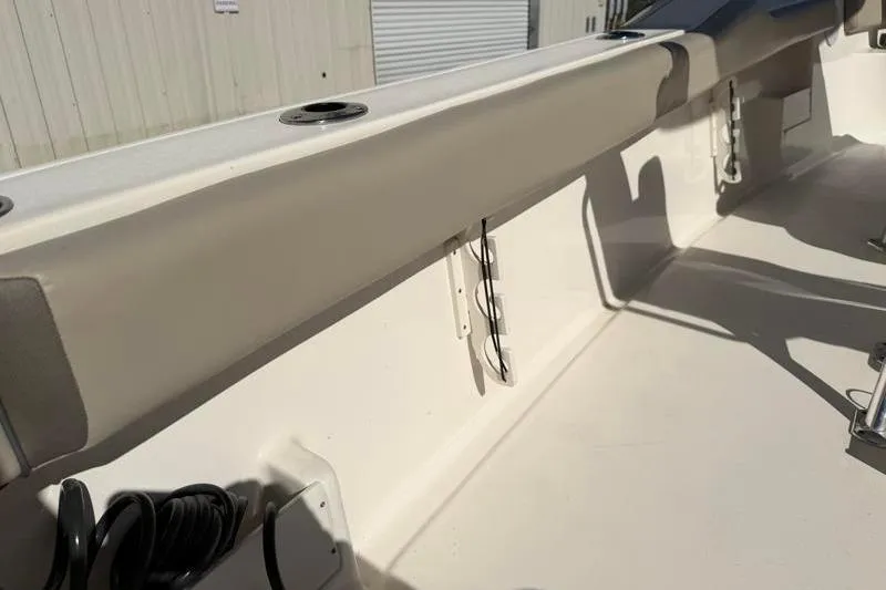 Slide: The Image of 2024 Key West 239 FS boat interior with rod holders and storage space. - 33