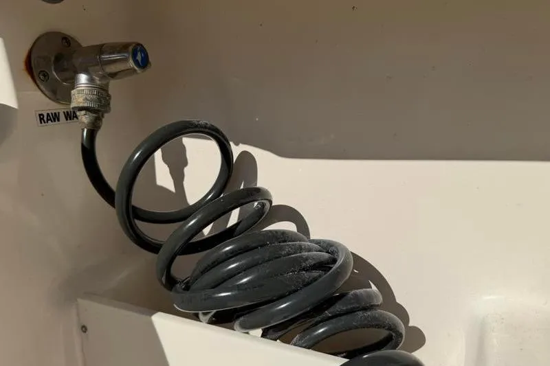 Slide: The Image of 2024 Key West 239 FS boat raw water washdown hose and faucet. - 34