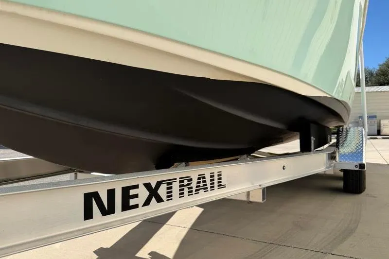 Slide: The Image of 2024 Key West 239 FS boat on NexTrail trailer, close-up view. - 37