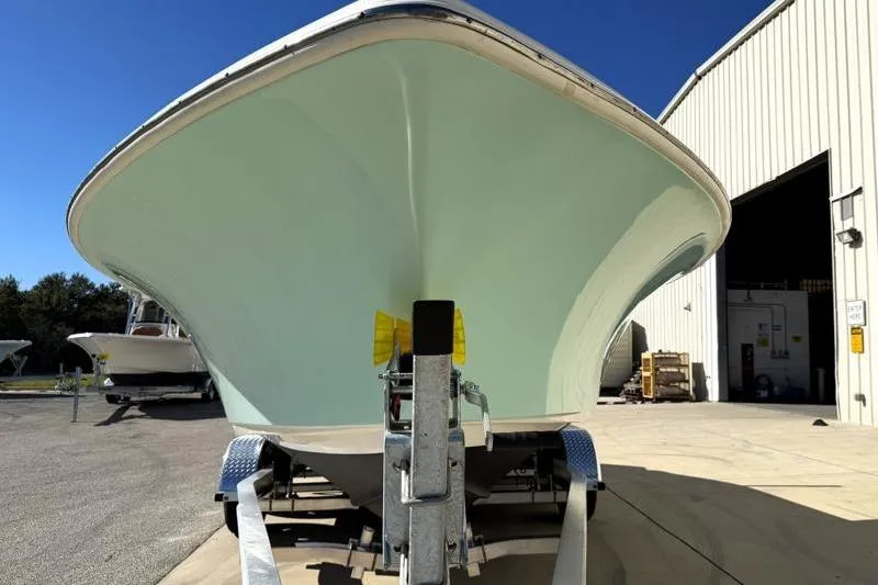 Slide: The Image of 2024 Key West 239 FS boat on trailer outside a warehouse. - 6