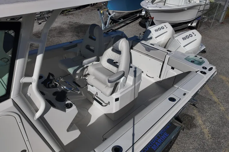 Slide: The Image of 2026 Sailfish 272 CC boat interior with dual seats and modern controls. - 10
