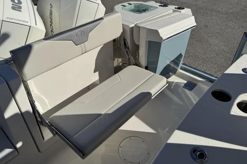 Slide: The Image of 2026 Sailfish 272 CC boat interior with foldable seat and storage compartments. - 11