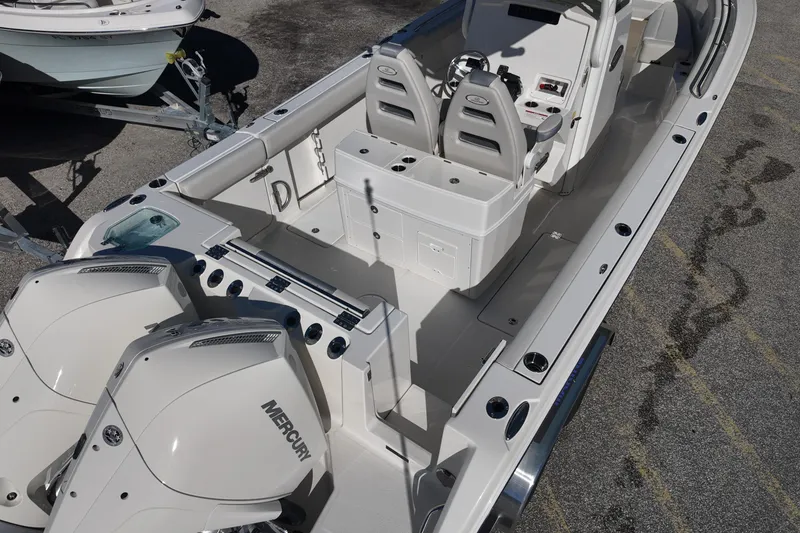 Slide: The Image of 2026 Sailfish 272 CC boat with dual Mercury engines, spacious deck, and modern controls. - 4