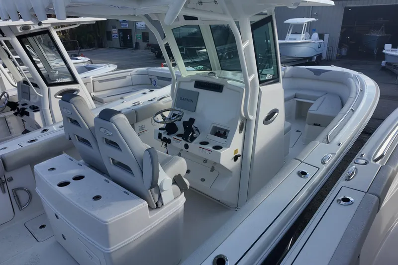 Slide: The Image of 2026 Sailfish 272 CC boat interior with dual helm seats and modern dashboard. - 5