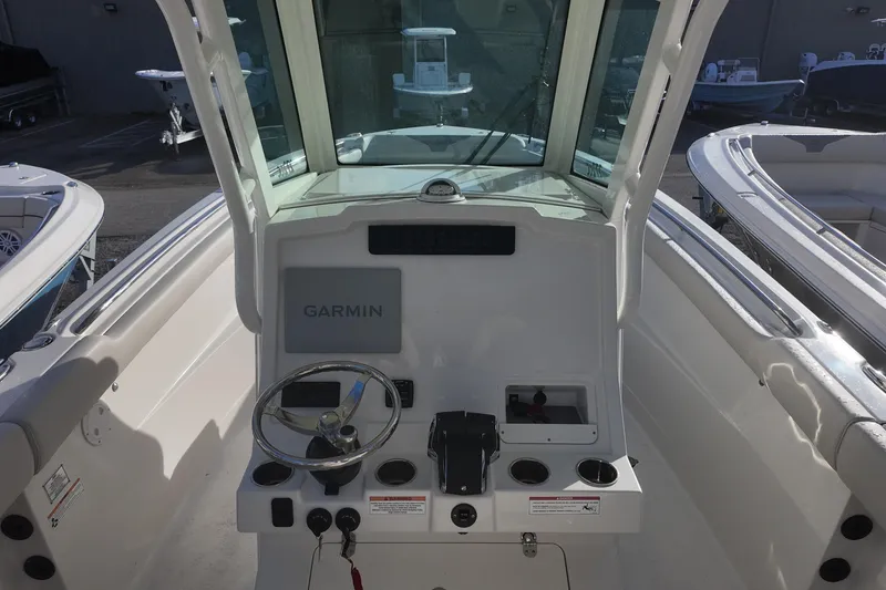 Slide: The Image of Cockpit view of 2026 Sailfish 272 CC boat with Garmin navigation system. - 6