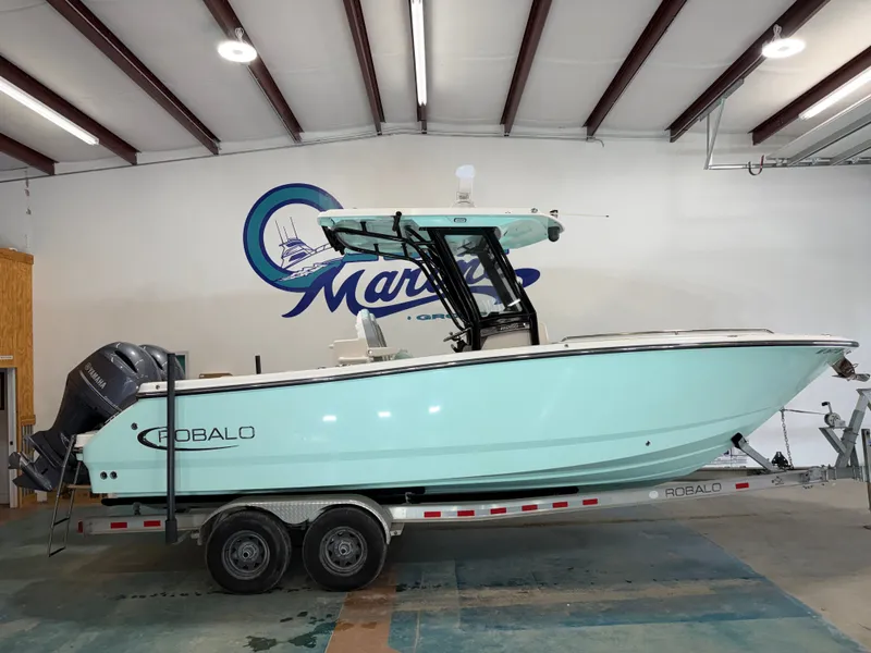 The Image of 2023 Robalo R250 Center Console boat in a showroom. - 1